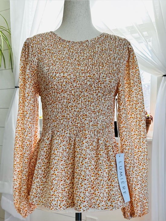 Lumiere Tops - Lumiere long sleeve feminine Floral Print Smocked Peplum Top. 
Size: Small